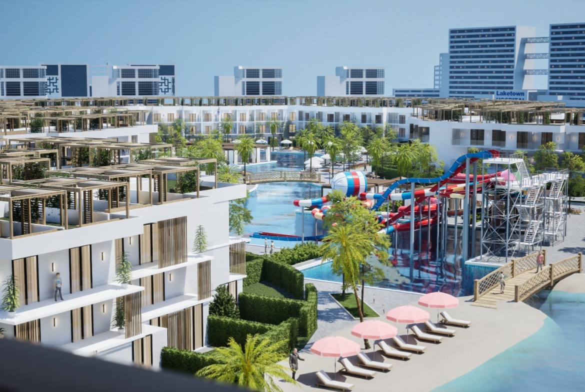 Night view of Holidays Park resort with illuminated pools and modern architecture