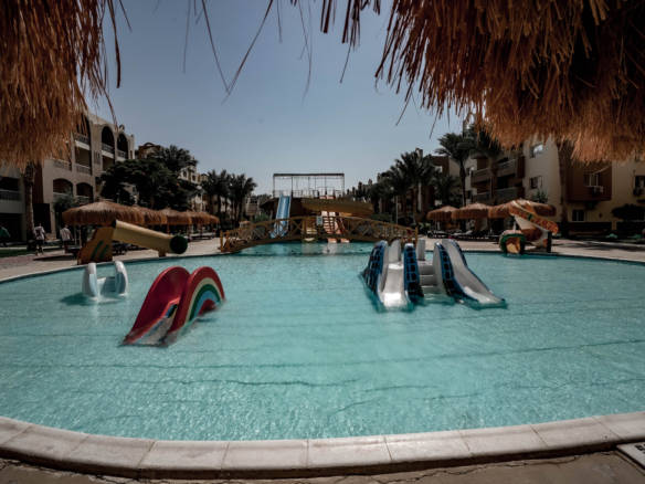 Relax by the pool at AlKarma Aqua Beach and enjoy the perfect blend of comfort, elegance, and seaside serenity.