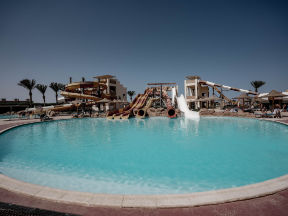 Relax by the pool at AlKarma Aqua Beach and enjoy the perfect blend of comfort, elegance, and seaside serenity.